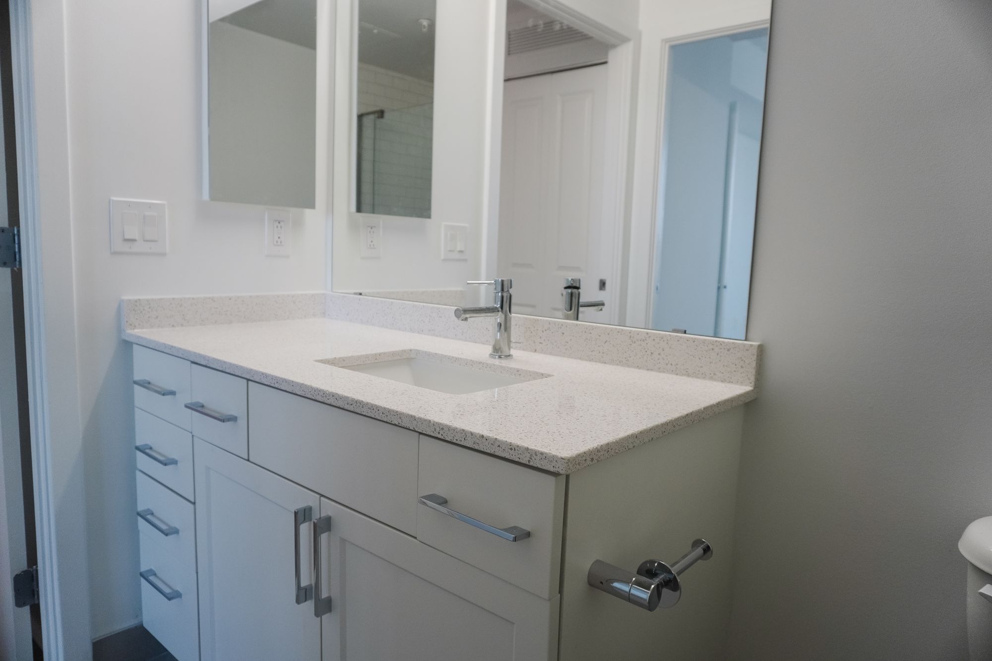 Renovated bathroom vanity with a quartz counter at DSC Apartments, Arlington, VA